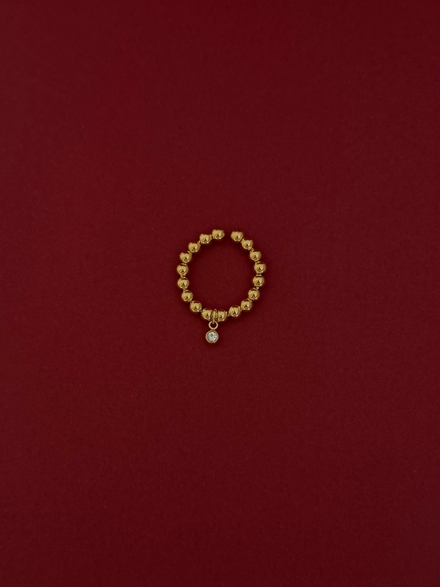 Anillo Bolita con Zirco Colgante Dorado